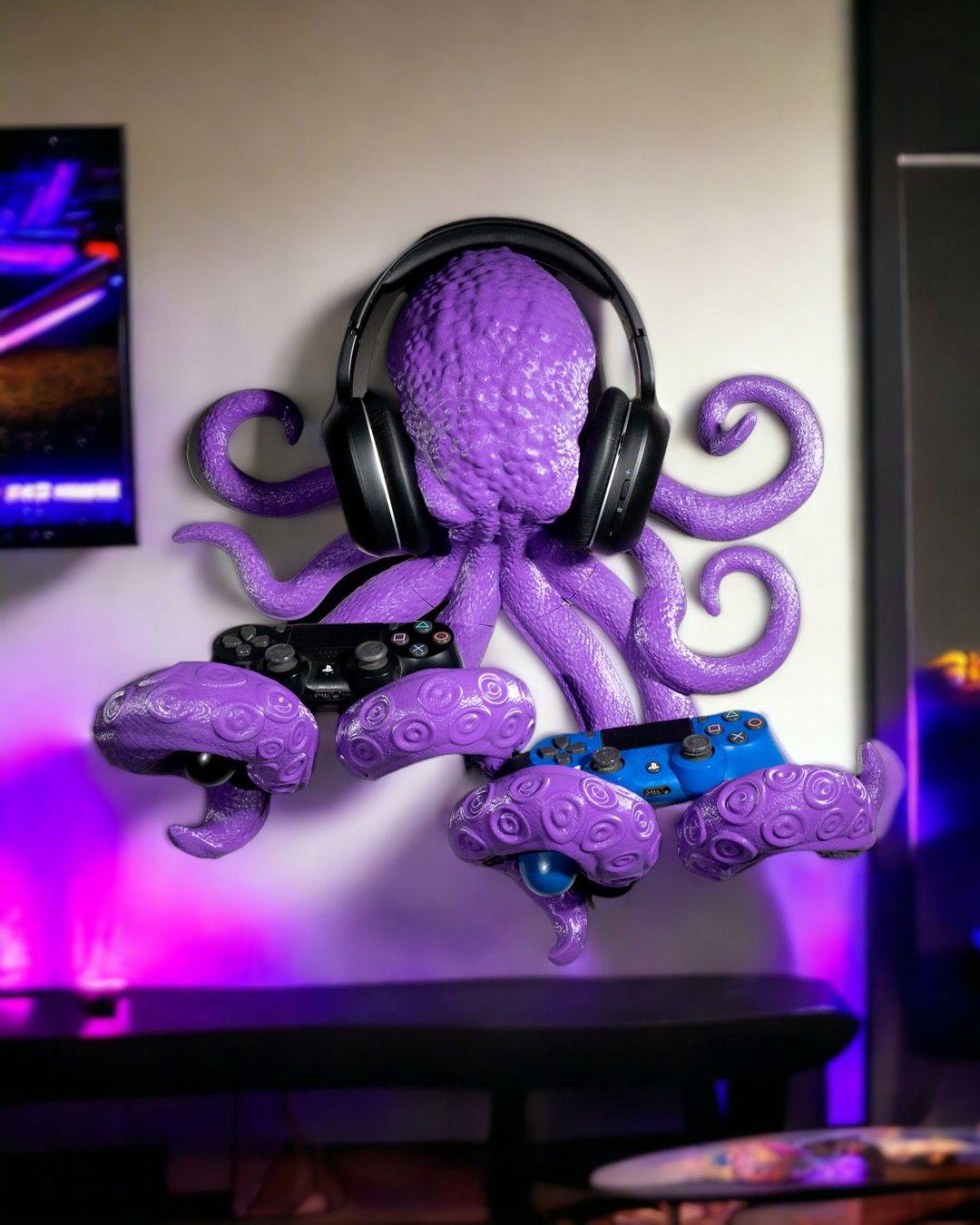 Purple 3D-printed octopus wall mount holding two game controllers and over ear headphones, gaming room organizer, headphones  are not included.